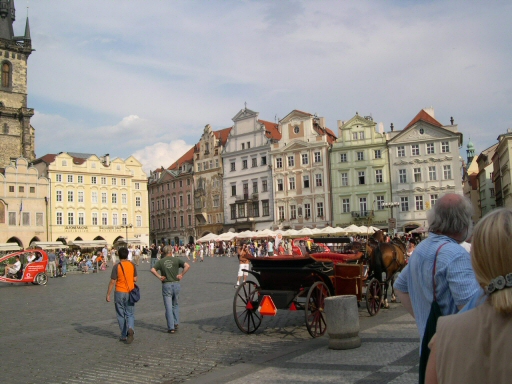Town square with fairytale buildings, horse-drawn carriages
