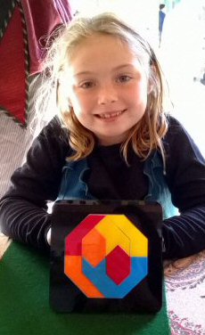 Smart little girl with her newly solved design for Rombix Jr.