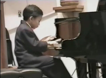 Kit Armstrong at age 8 plays Bach--click here to view