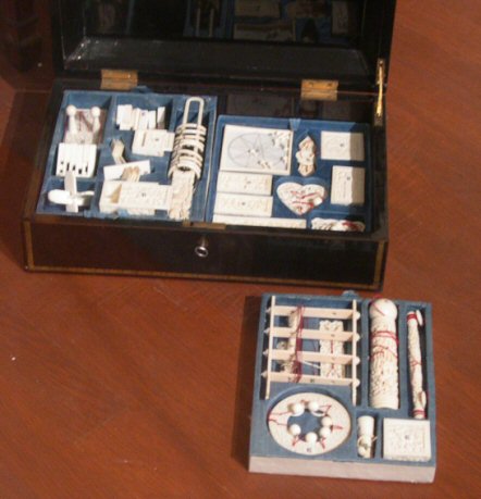 Chinese puzzle box filled with classic ivory puzzles