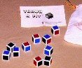 Throw A Fit--dice game of probability, 3-D puzzles